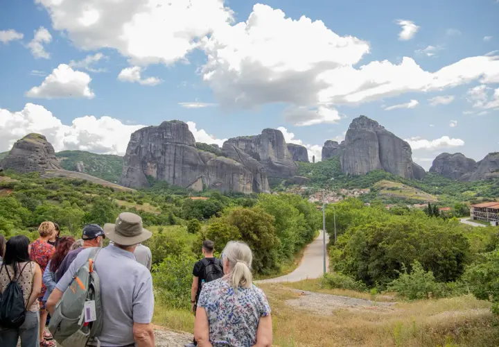 Tourists admire the stunning Meteora price, with its towering rock formations and monasteries.