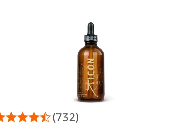 Frasco ámbar con gotero de ICON India Oil, un aceite exótico para el cabello.