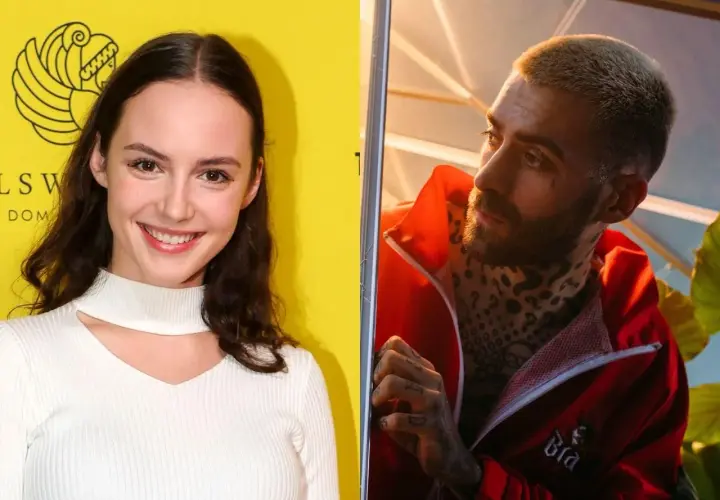Martyna Byczkowska uśmiecha się na tle żółtej ściany, obok Quebo w czerwonej kurtce z tatuażami.