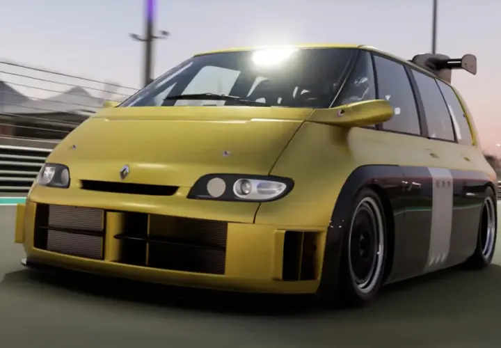 Żółty Renault Espace F1 z potężnym spojlerem i szerokimi wlotami powietrza pędzi po torze wyścigowym.