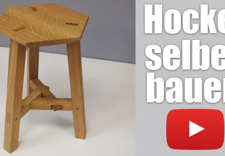 Ein sechseckiger Holzhocker mit drei Beinen, der zeigt, wie man einen dreibein holz selber bauen kann.