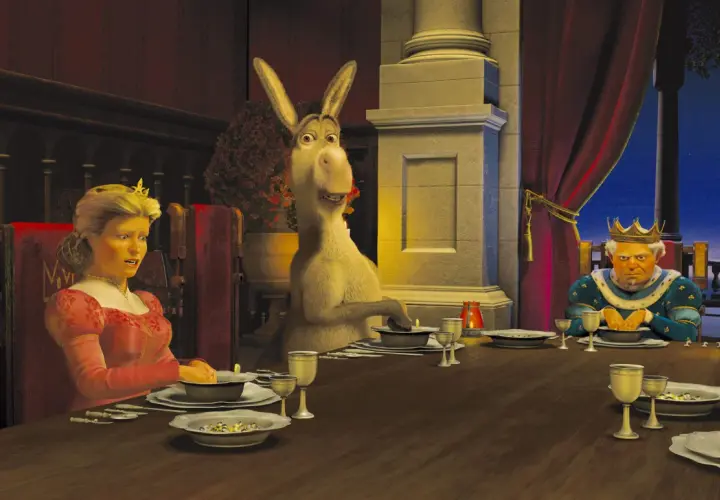 Królowa Fiona, Osioł i Król Harold przy stole. Scena z jednego z filmów DreamWorks.