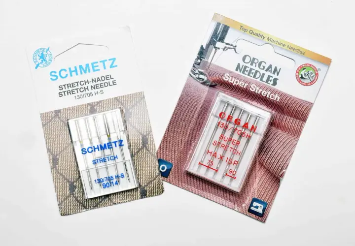 Two packages of sewing machine needles for knits: Schmetz Stretch and Organ Super Stretch.