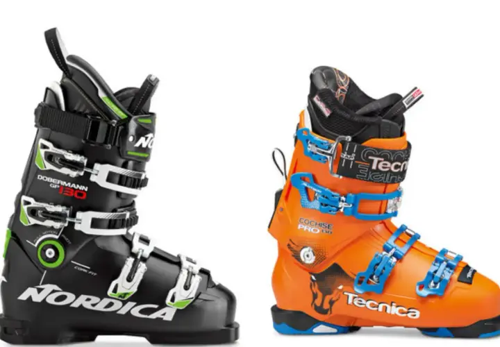 Dwa buty narciarskie: czarny Nordica Dobermann GP 130 i pomarańczowy Tecnica Cochise Pro 130. Gotowe do zapinania butów narciarskich.