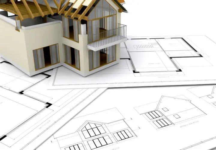 Model domu na planach architektonicznych. Zastanawiasz się, ile trwa budowa domu? To zależy od wielu czynników, ale projekt to pierwszy krok.