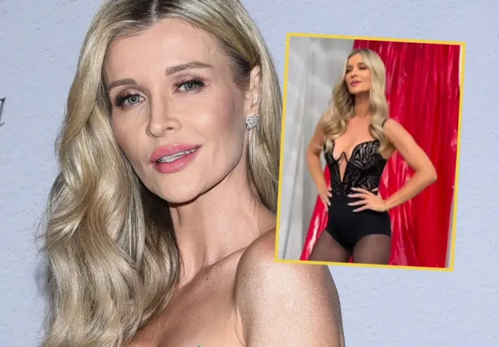 Joanna Krupa, której wiek nie przeszkadza w prezentowaniu się w zmysłowej stylizacji, pozuje w czarnym body i rajstopach na tle czerwonej kurtyny.