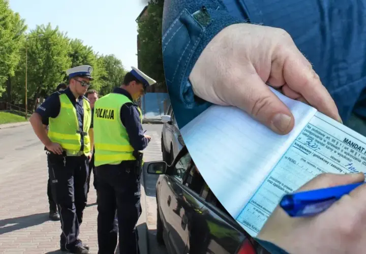 Policjanci wypisują mandat za wykroczenie, być może niebezpieczne wyprzedzanie. Kierowca otrzymał karę finansową.