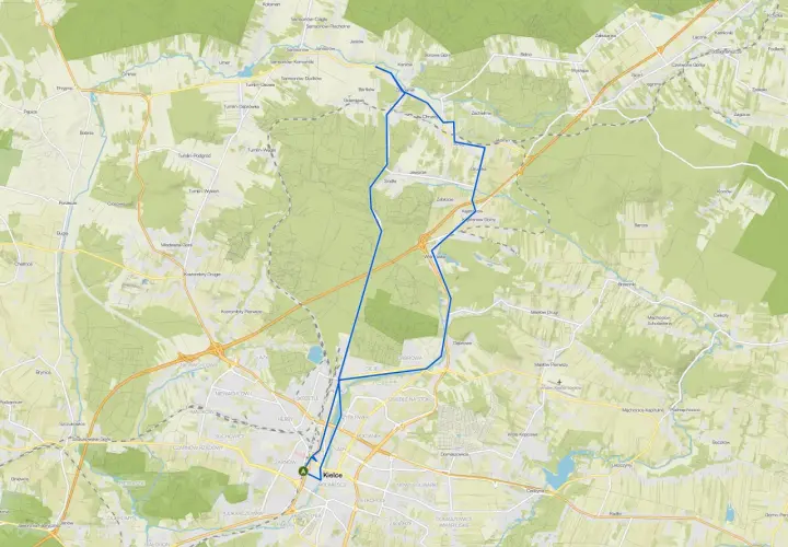Mapa z zaznaczonymi ścieżkami rowerowymi w okolicach Kielc, prowadzącymi przez tereny zielone i miejscowości.