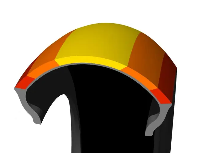 Corte transversal de un neumático con capas de colores, mostrando la tecnología que inspira las **Bridgestone S21 opiniones**.