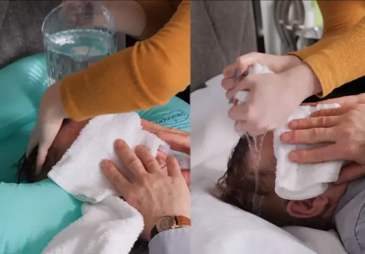 Demostración de cómo lavar el pelo a una persona encamada con una tina inflable y toallas.