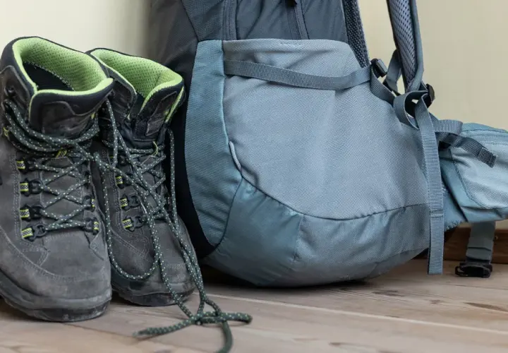 Hiking boots and backpack ready for adventure. Learn the best way to clean hiking boots to keep them in top condition for your next trek.