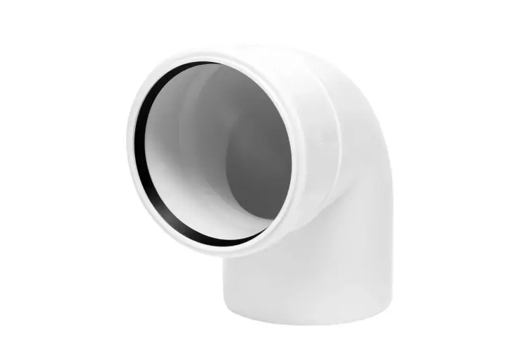 Białe kolano do WC 90 st. z przyłączem, element instalacji kanalizacyjnej.