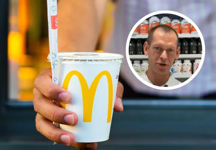 Dłoń trzyma kubek z logo McDonald's. W tle mężczyzna mówi o tym, ile ml ma duża cola z McDonald's.