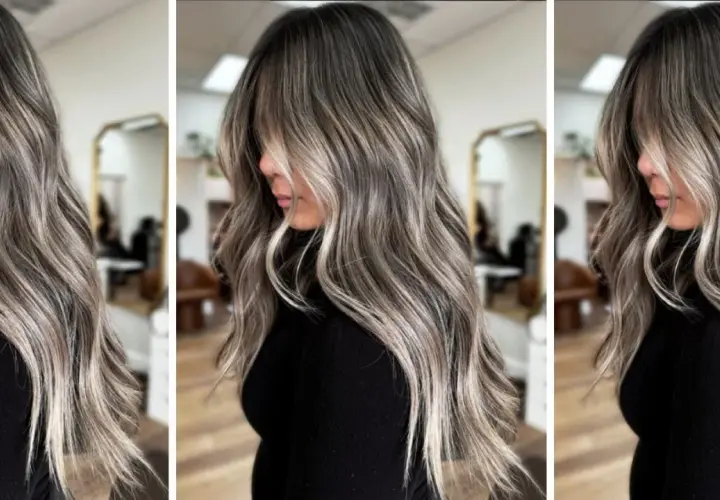 Pelo largo y ondulado con un degradado de color que combina canas y mechas rubias, creando un efecto moderno y natural.