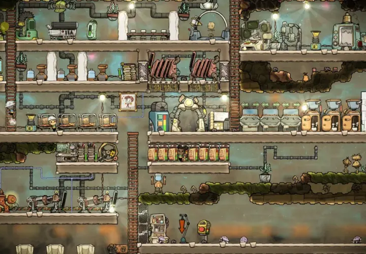 Kolonia w Oxygen Not Included, spolszczenie gry. Widać tu wielopoziomową bazę z rurami, maszynami i klonami.