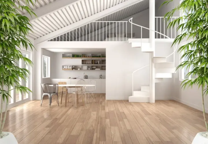 Interno moderno con cucina, tavolo e sedie. Una scala a chiocciola bianca porta a un soppalco a vista. Bambù verde incornicia la scena.