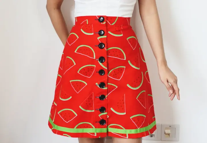A-line skirt with a fun watermelon print, featuring black buttons down the front. Get this printable a line skirt pattern free and sew your own summer style!