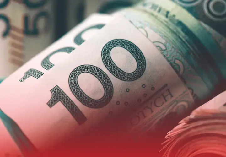 Zwijane banknoty 100 zł, symbolizujące zarobki, być może nawet najniższa krajowa na godzinę.