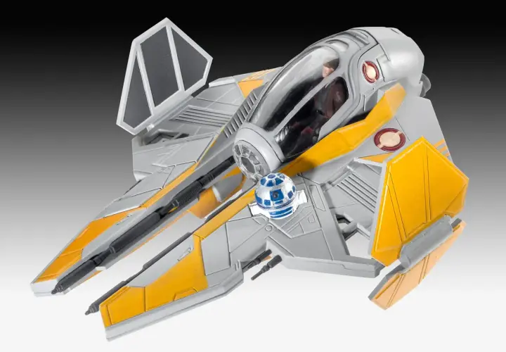 Model statku kosmicznego star wars starfighter w kolorze szaro-żółtym, z droidem R2-D2 na pokładzie.