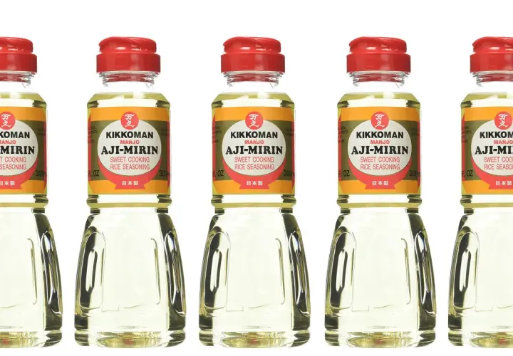 Five bottles of Kikkoman Aji-Mirin, a sweet cooking rice seasoning. Mirin is used to add sweetness and glaze to Japanese dishes.
