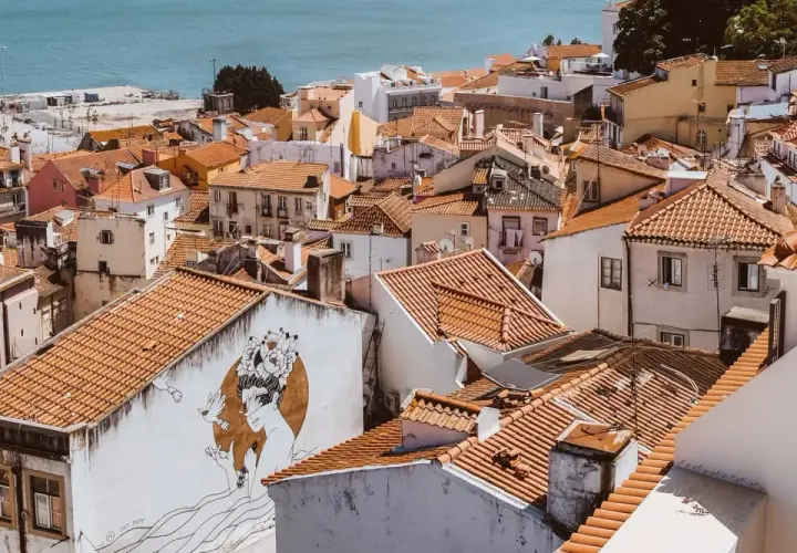 Alfama, Lisbon, is a charming, historic district with narrow streets and colorful buildings. It's generally considered safe for tourists.