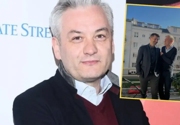 Robert Biedroń i Krzysztof Śmiszek stojący obok siebie na balkonie.