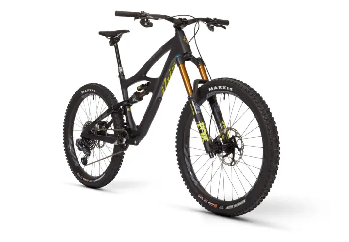 A black Ibis HD5 mountain bike with gold Fox suspension forks and Maxxis tires, ready for any trail.