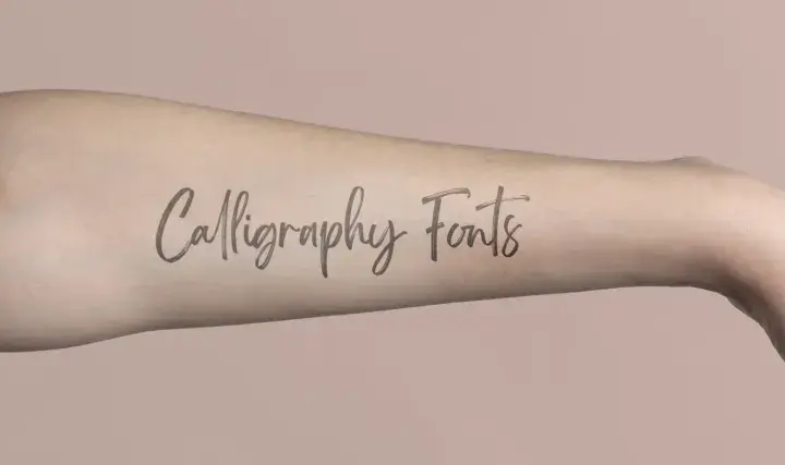 Delikatna kaligrafia tatuaz na ramieniu, napis "Calligraphy Fonts" w stylu pisanki.