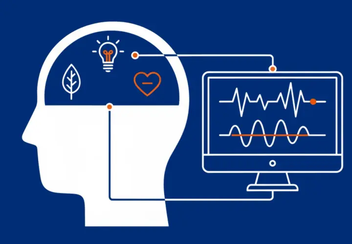 Grafika ilustruje, neurofeedback co to: połączenie mózgu z monitorem pokazującym fale mózgowe, symbolizujące proces uczenia się i samoregulacji.
