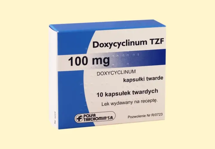 Opakowanie leku Doxycyclinum TZF 100 mg, zawierające 10 kapsułek twardych. Jest to antybiotyk z grupy tetracyklin.
