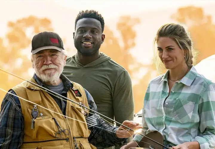 Brian Cox w kamizelce wędkarskiej z dwójką towarzyszy, gotowi na przygodę. Zapowiada nowe brian cox filmy seriale i programy.