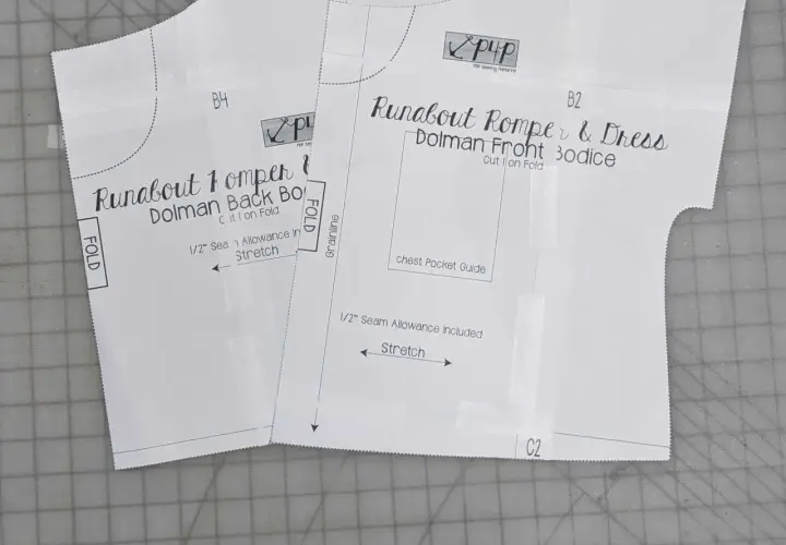 Close-up of a DIY romper pattern for a "Runabout Romper & Dress," showing front and back bodice pieces with instructions like "Cut 1 on Fold" and "Stretch.
