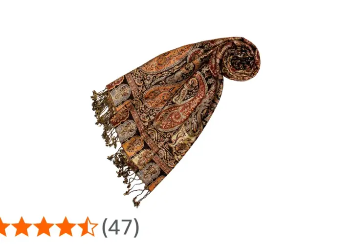 Elegancka pashmina z wzorem paisley w odcieniach brązu i pomarańczy, z frędzlami. Idealna na chłodniejsze dni.
