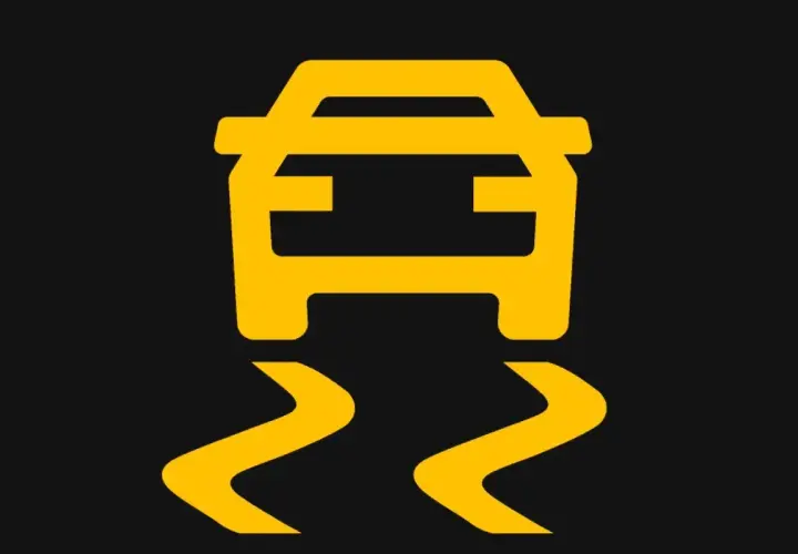 Voyant ESP allumé, signalant une perte d'adhérence. Attention, la route est glissante !