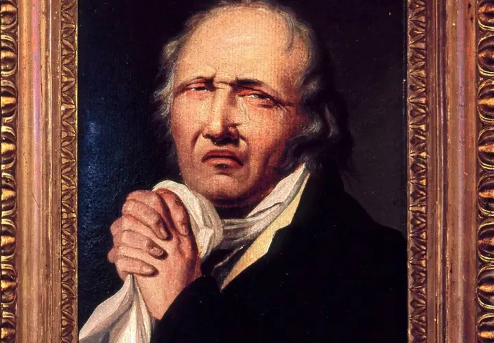 Portret mężczyzny z chusteczką w dłoniach, z wyrazem cierpienia na twarzy. Obraz przedstawia, kim był Wojciech Bogusławski, aktor i dramaturg.