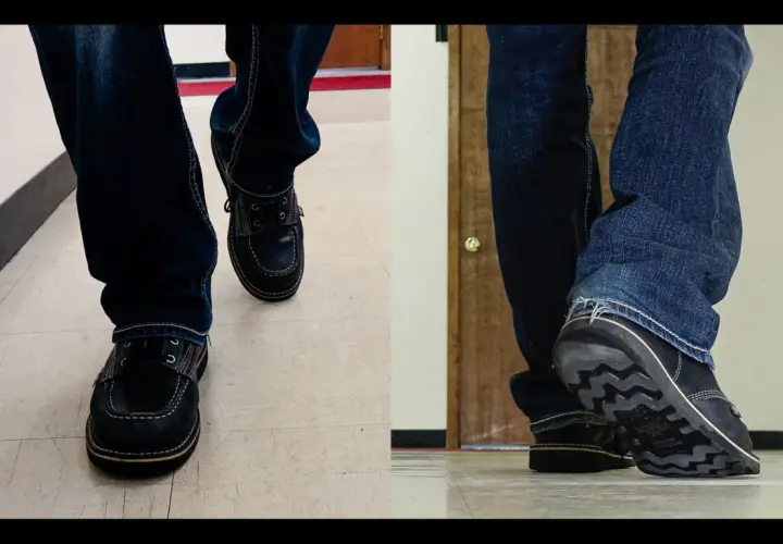 Close-up of feet in jeans and dark shoes. The shoes are made of what looks like real leather, and you can almost hear them squeak with every step.