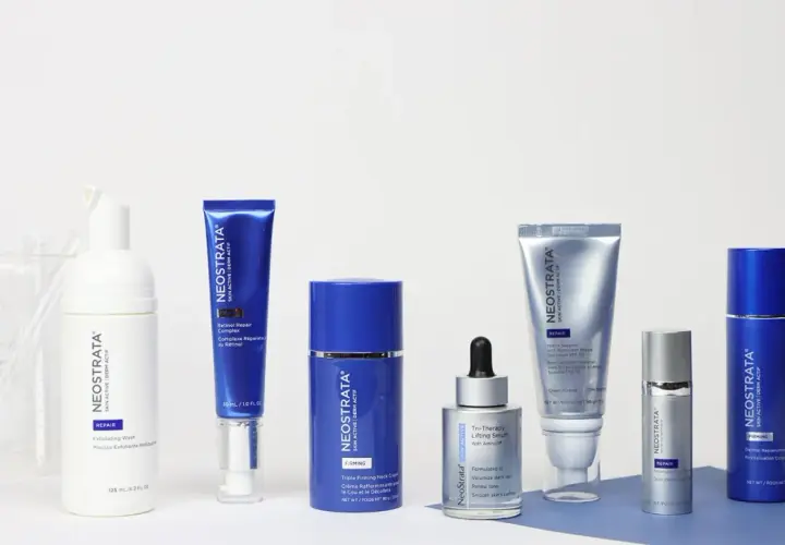 A collection of Neostrata skincare products, including serums, creams, and a wash, arranged on a white surface.