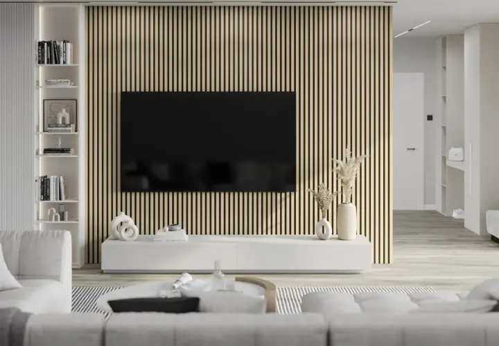 Nowoczesny salon z telewizorem na tle ściany z pionowych **lamelki**. Jasne meble i subtelne dekoracje tworzą przytulną atmosferę.