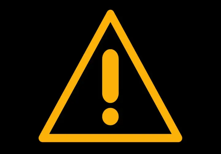 Triángulo amarillo con signo de testigo de exclamación, como el de un Volkswagen, indica precaución.