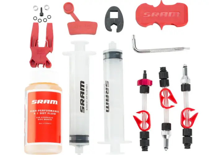SRAM brake bleed kit with syringes, fluid, bleed block, and adapters.