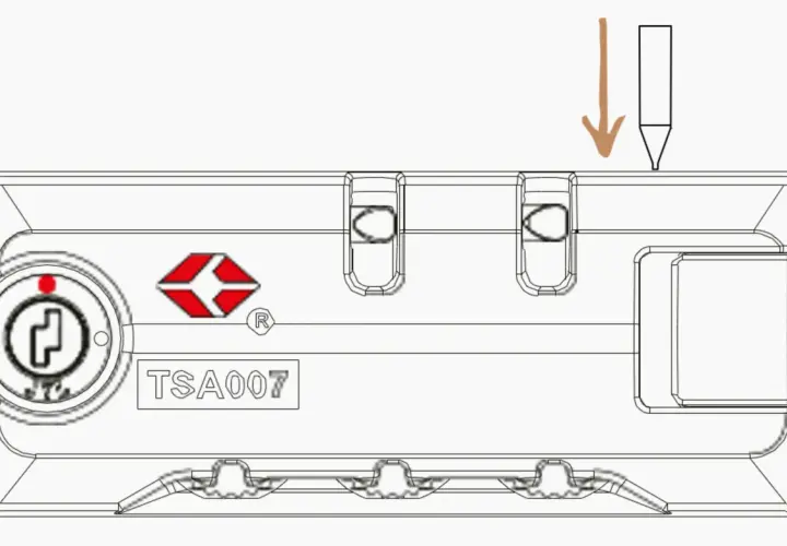 Schemat blokady TSA z cyframi i miejscem na klucz. Strzałka wskazuje, jak zresetować kod w walizce Wittchen.