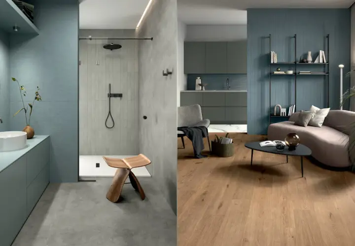 Bagno moderno con pavimento in resina e doccia con piastrelle verticali, affiancato da un soggiorno con pavimento in legno e pareti blu.