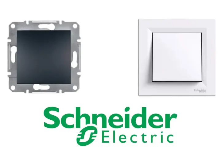 Biały przełącznik góra dół Schneider Electric obok mechanizmu montażowego.