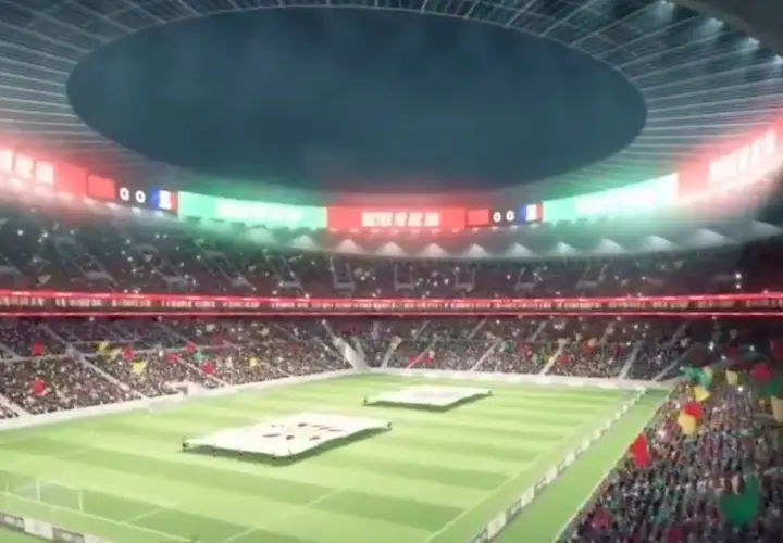 Widok na trybuny wypełnione kibicami na największym stadionie na świecie. Na murawie rozłożone są wielkie transparenty.