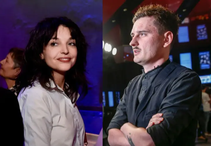 Dawid Podsiadło i jego partnerka, uśmiechnięta kobieta w białej koszuli, obok niego mężczyzna w czarnej marynarce.