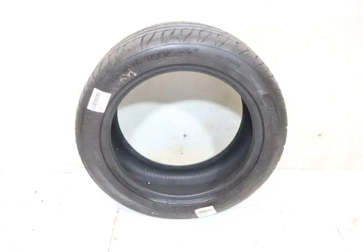 Opona 205/50 R16 87V, idealna do Renault Clio II 1.2, z oznaczeniem "OUTSIDE" i kodem kreskowym.