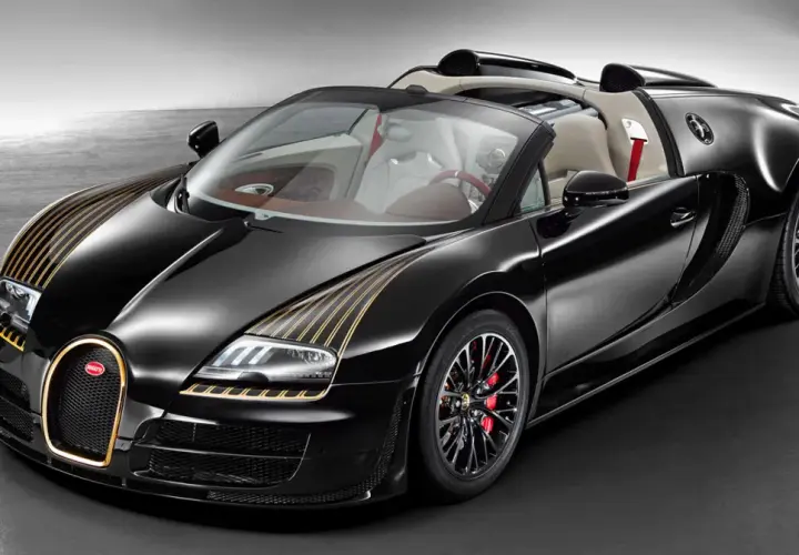 Czarny Bugatti z złotymi pasami, otwarty dach, skórzane wnętrze. Zastanawiasz się, ile kosztuje Bugatti?