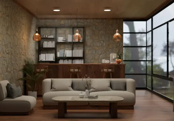 Przytulny salon z kamienną ścianą, gdzie oświetlenie kamienia dekoracyjnego tworzy ciepłą atmosferę. Wygodna sofa i fotel zapraszają do relaksu.