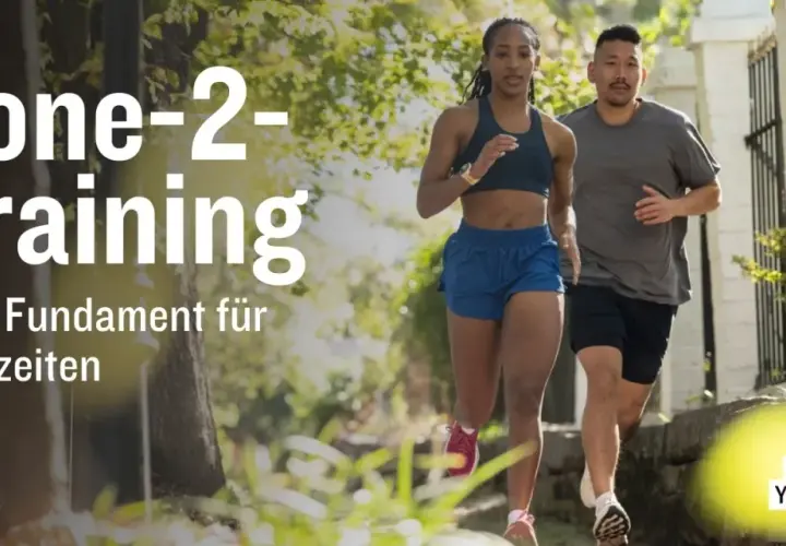 Ein Mann und eine Frau laufen im Freien. Der Text "Zone-2-Training" und "Dein Fundament für Bestzeiten" ist prominent platziert.