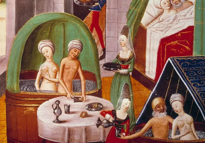 Miniatura średniowieczna: kobiety i mężczyzna w kąpieli, kobiety podają napoje.